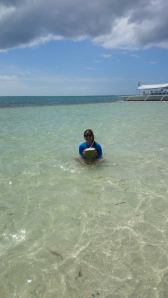 Enjoying fresh coconut water in the middle of the sea at Virgin Island, Bohol